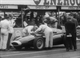 20. F2-27. Stirling Moss No18 (GB) Vanwall, in pits looking into engine bay, British GP 1957.