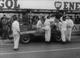 24. F2-29. Tony Brooks No20 (GB) Vanwall, helped out by pit crew, British GP, Aintree 1957.