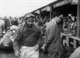 34. F2-8. Jean M Fangio No2 (Arg) Maseratti 250F, walking in pits, British GP, Aintree 1957.