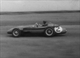 28. F2-20. Jean M Fangio No2 (ARG) Maserati 250F at speed, British GP, Aintree 1957.