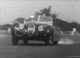 44. F2-15. Stirling Moss in a Jaguar XK120 showing everyone the art of four wheel drifting.