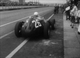 30. F2/10.24. Les Leston No26 (GB) BRM P25, into pits, British GP, Aintree 1957.