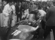 35. F2-25. Tony Brooks No18 (GB) Vanwall in pits with bonnet off, British GP, Aintree 1957.